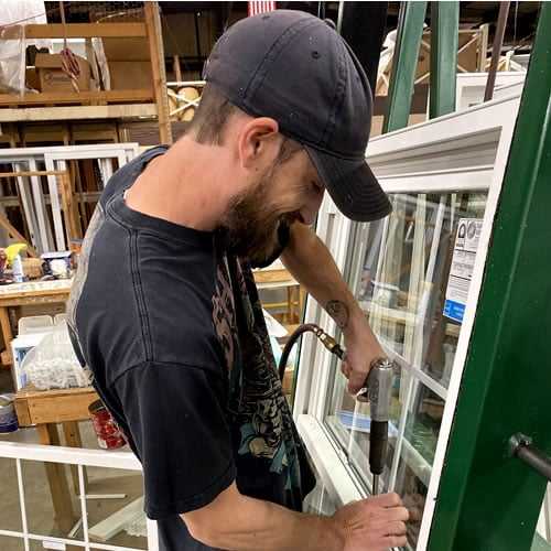 Coastal-Industries, Inc. | Employee building a custom window